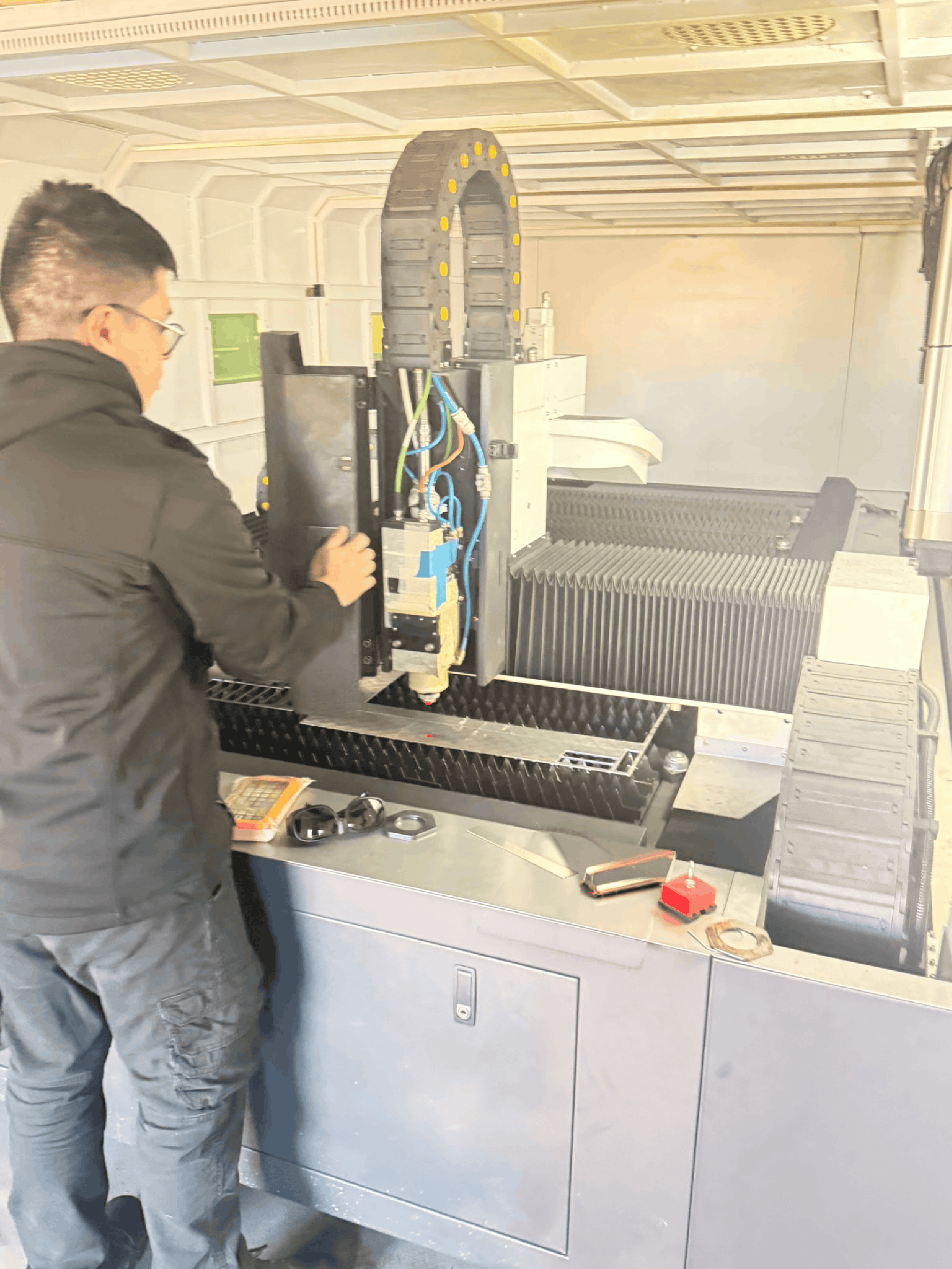 Technician operating the fiber laser